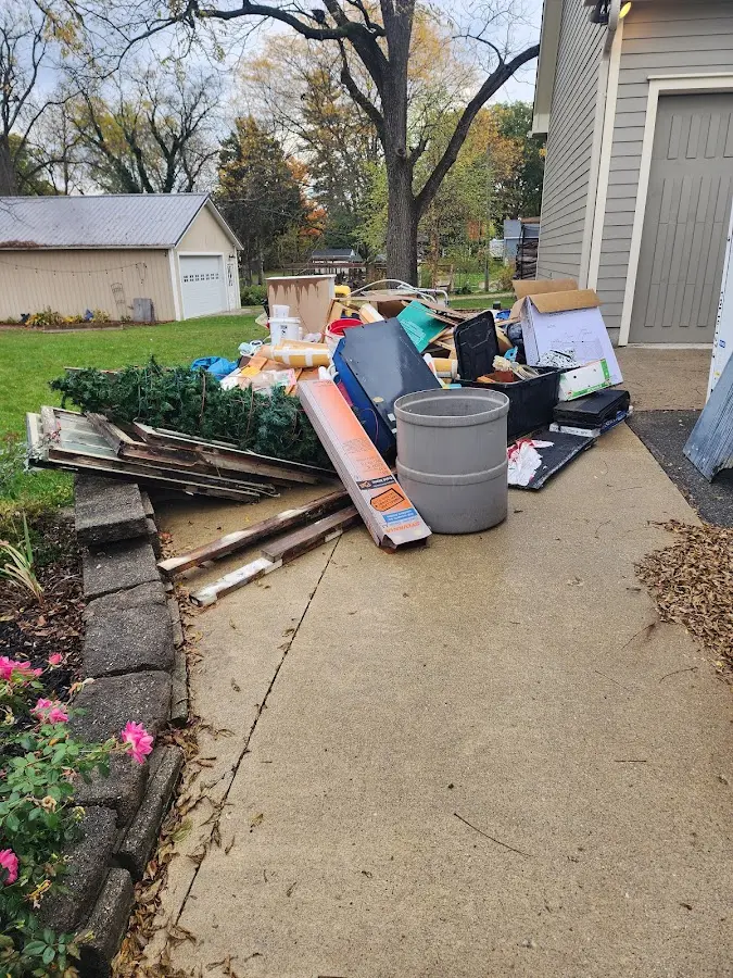 Dumpster being loaded with debris for 3 Yard Dumpster Rental in Fayetteville